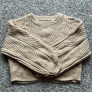 Cropped cable knit bishop sleeve sweater